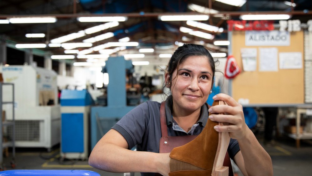 An artisan at Nisolo's factory in Peru working on the brand's Chelsea boot.