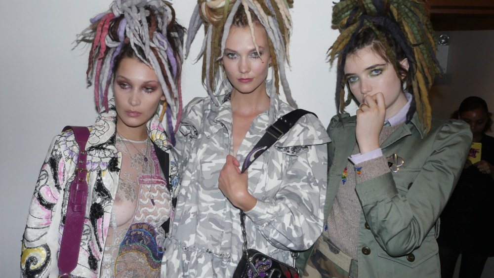 Bella Hadid, Karlie Kloss and Grace Hartzel backstage at the Marc Jacobs spring 2017 runway show in dreadlock wigs, which Jacobs apologized for after the show.