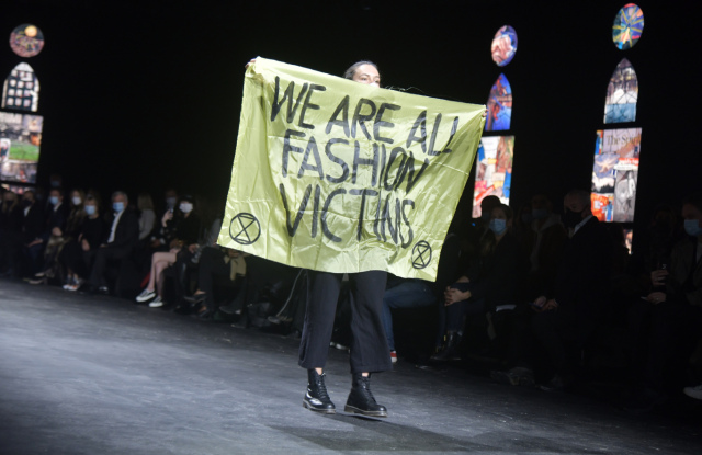 A protester at the Dior spring 2021 show.