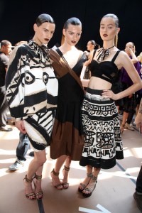 Models backstage at Donna Karan's spring 2012 runway show.