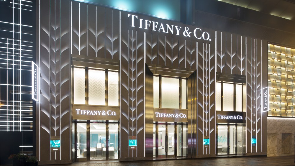 A Tiffany & Co. Hong Kong store front lit up at night.