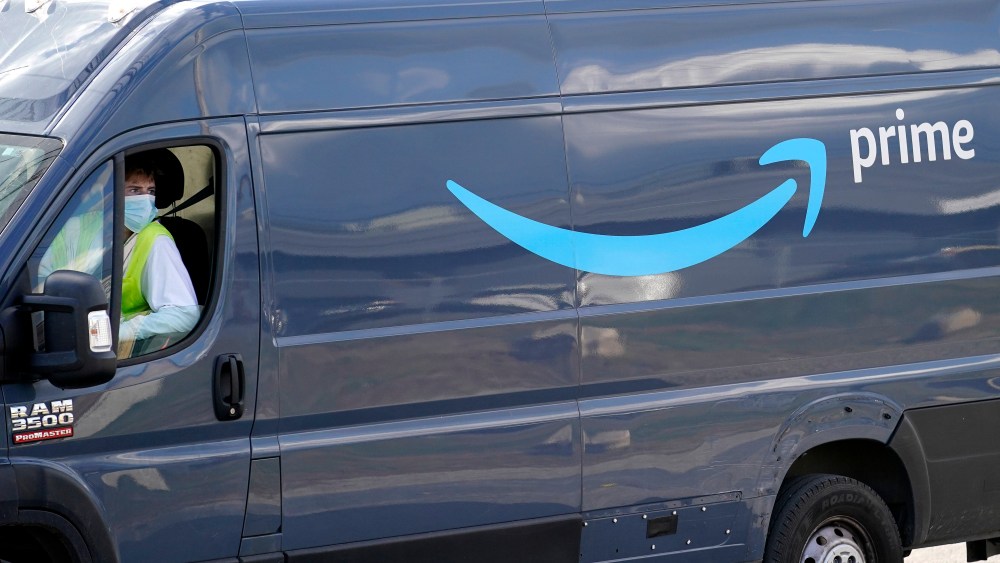 An Amazon Prime logo appears on the side of a delivery van as it departs an Amazon Warehouse location, Thursday, Oct. 1, 2020, in Dedham, Mass., (AP Photo/Steven Senne)