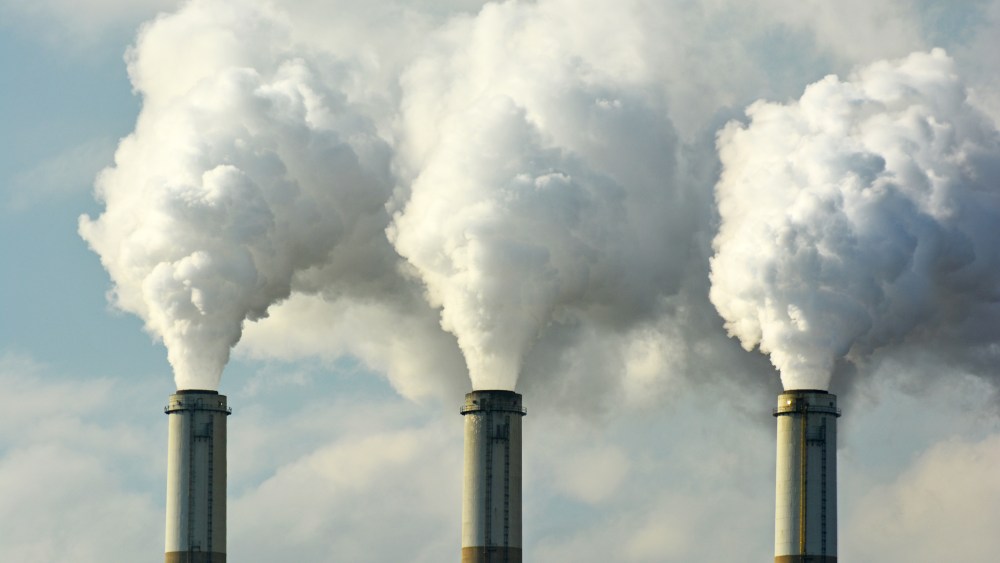Multiple Coal Fossil Fuel Power Plant Smokestacks Emit Carbon Dioxide Pollution