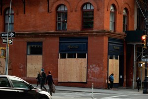 Boarded up stores across SoHo in New York .