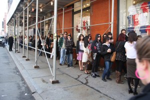 Crowds wait outside the opening of a Topshop in NY, 2009.