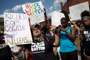 Protestors rally during a Black Lives Matter demonstration, Sunday, July 10, 2016, in Cincinnati.