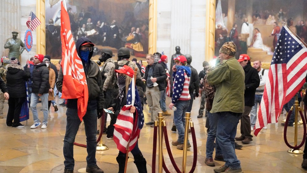 Protestors enter the Capitol building during a joint session of Congress in Washington, DC on Wednesday, January 6, 2021.