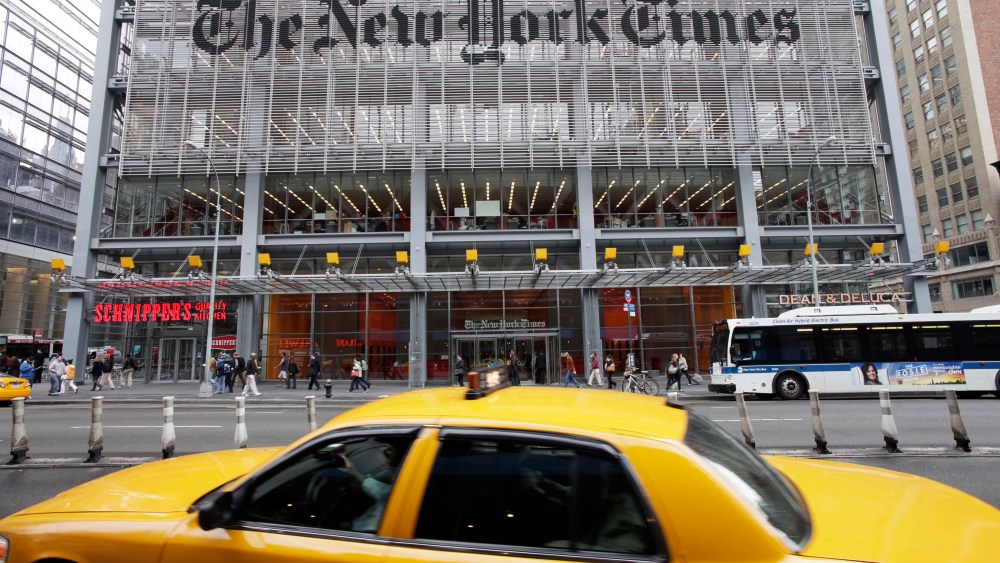 FILE - In this Oct. 18, 2011 file photo, traffic passes the New York Times building, in New York. In a Monday, Nov. 2, 2015 State of the Times speech to employees, New York Times publisher Arthur Sulzberger said his successor will be chosen within two years. (AP Photo/Mark Lennihan, File)