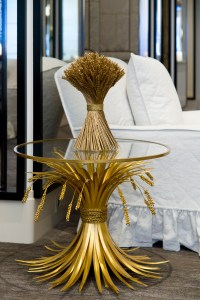 A side table with gilded bronze wheatsheaf legs by Goossens in Chanel's renovated haute couture salon in Paris