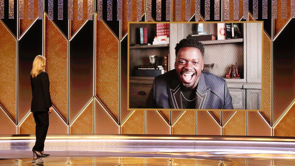 Laura Dern presents the Best Supporting Actor - Motion Picture award for ‘Judas and the Black Messiah’ to winner Daniel Kaluuya .