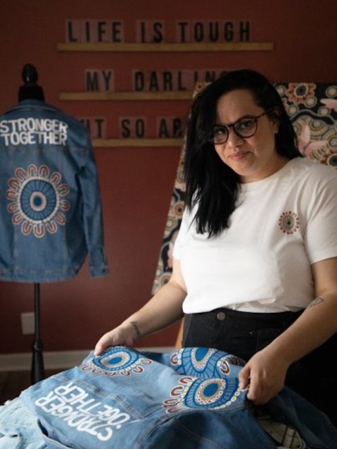 Outland Denim collaborated with indigenous artist Regina Jones on a collection of T-shirts and tote bags featuring feminist artwork.