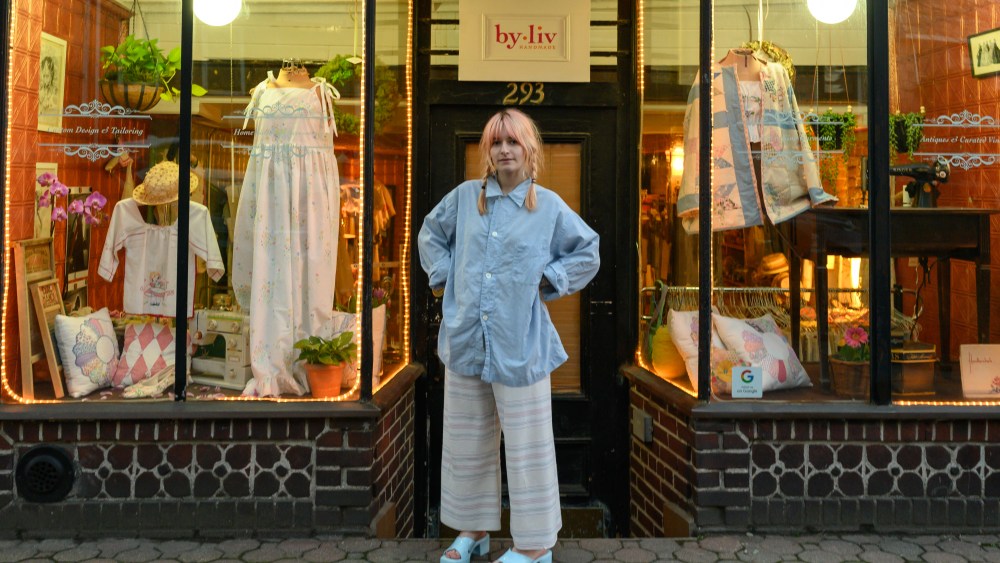 Olivia Reinertson in front of the store for her brand, By Liv.