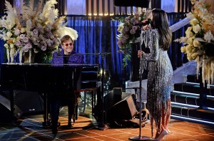 Sir Elton John and Dua Lipa performing