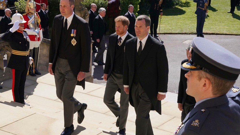Prince William, Prince Harry and Peter Phillips, from right, follow the coffin into St George's Chapel during the procession of Britain Prince Philip's funeral at Windsor Castle, Windsor, England, Saturday April 17, 2021. Prince Philip died April 9 at the age of 99 after 73 years of marriage to Britain's Queen Elizabeth II. (Arthur Edwards/Pool via AP)