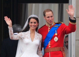 Britain's Prince William and his wife Kate, Duchess of Cambridge wave from the balcony of Buckingham Palace after the Royal Wedding in London Friday, April, 29, 2011. (AP Photo/Matt Dunham)