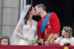 FILE-   This Friday, April 29, 2011 file photo shows Prince William and his wife Kate Middleton, who has been given the title of The Duchess of Cambridge, as they kiss on the balcony of Buckingham Palace, London, following their wedding at Westminster Abbey. People love the wedding kiss, and they have definite opinions about how a couple should seal the deal.  (AP Photo/John Stillwell, Pool, File)