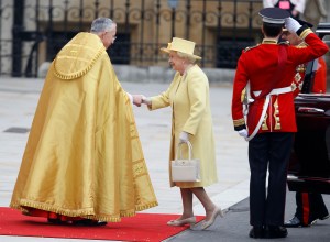 The Dean of Westminster John Hall, left, greets Britain's Queen Elizabeth II at Westminster Abbey at the Royal Wedding in London Friday, April 29, 2011. (AP Photo/Alastair Grant)