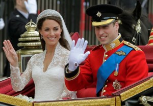 Britain's Prince William and his wife Kate, Duchess of Cambridge, left, wave as they leave Westminster Abbey at the Royal Wedding in London Friday, April, 29, 2011. (AP Photo/Alastair Grant)
