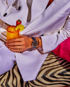 Louis Vuitton's Escale Spin Time Meteorite 41 with titanium case with satin-finished black PVDand 18-karat pink gold bezel, horns and crown. Cartier Love 18-karat yellow gold bracelet. Clash de Cartier 18-karat rose gold ring. Alexander McQueen wool suit. Brimstone drink.