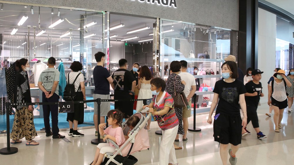 ManMany people gather to buy duty-free goods at a duty-free shop in Sanya, Hainan Province on May 1, 2021. The consecutive holidays of International Workers' Day (May Day) continued until May 5th. y people gather to buy duty-free goods at a duty-free shop in Sanya City, Hainan Province on May 1, 2021. The consecutive holidays of International Workers' Day (May Day) will continue until May 5th. ( The Yomiuri Shimbun via AP Images )