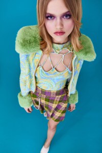 House of Sunny’s viscose, nylon and polybutylene terephthalate cardigan and top; Javy Solano’s wool skirt. Sam Edelman sandal;  Jennifer Zeuner necklace, ring and anklet; Brent Neale ring; Miansai rings and bracelets.