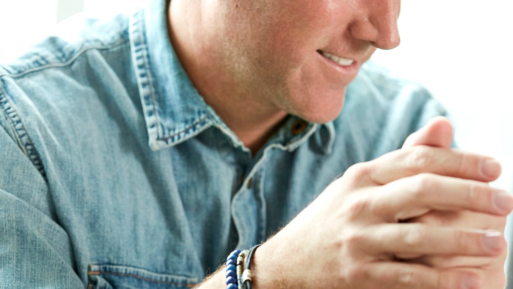 Kendra Scott chief executive officer Tom Nolan wearing Scott Bros. by Kendra Scott in a brand campaign.