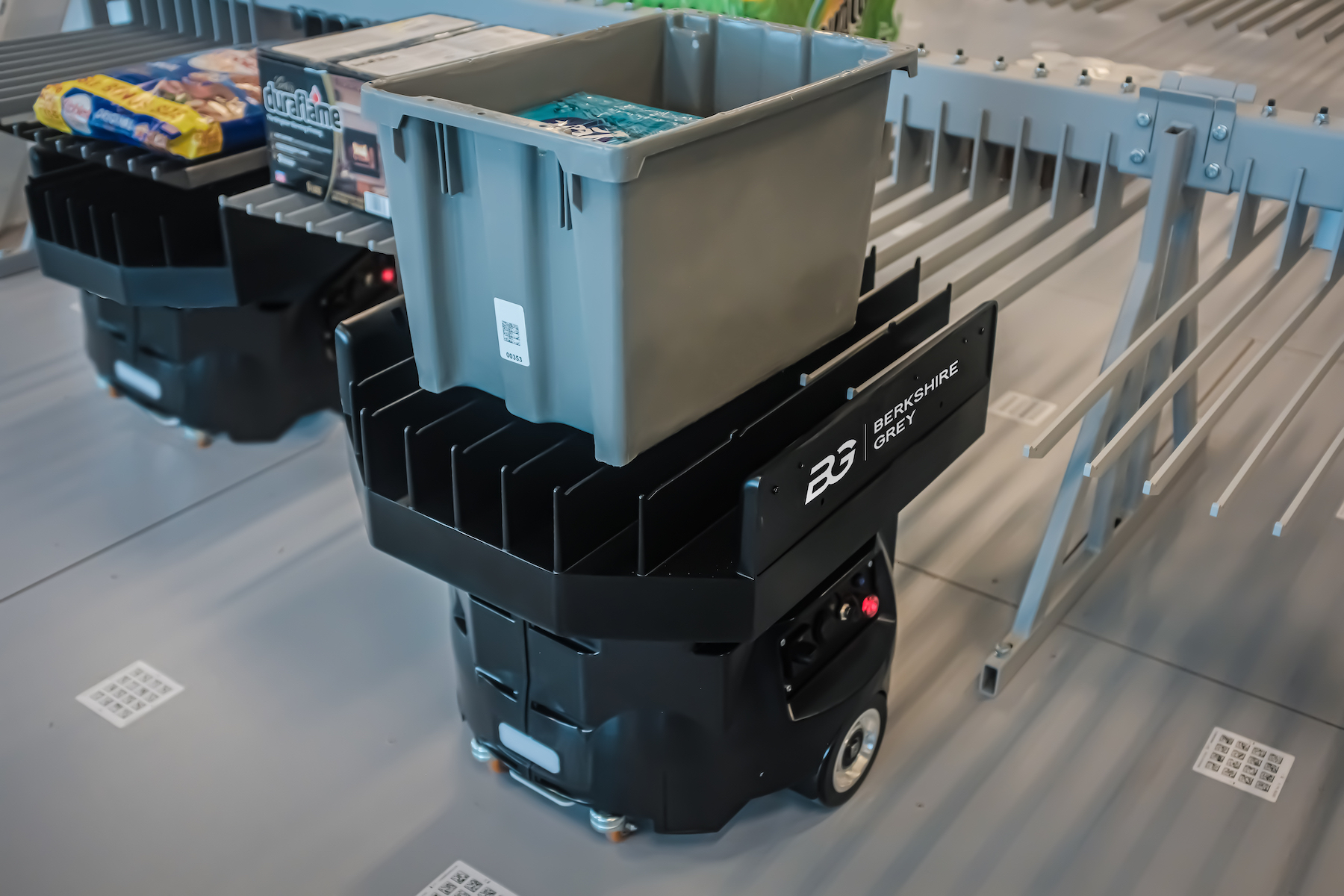 Unlike fixed conveyor belts and early generation mobile robots, Berkshire Grey’s intelligent fleets harness AI to orchestrate “tens to thousands” of mobile robots to pick, organize and deliver items for a wide variety of customer and store orders.