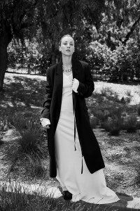 Ann DemeulemeesterÕs wool coat, cotton poplin dress and sleeves. Proenza Schouler slides; Givenchy necklace.