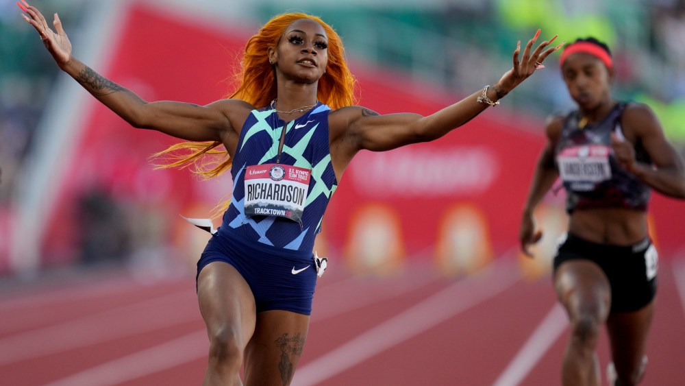 Sha'Carri Richardson celebrates after winning the fourth heat during the women's 100-meter run at the U.S. Olympic Track and Field Trials Friday, June 18, 2021, in Eugene, Ore. (AP Photo/Ashley Landis)
