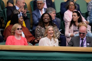 Sophie, Countess of Wessex, centre, attends the women's singles semifinals match between Germany's Angelique Kerber and Australia's Ashleigh Barty on day ten of the Wimbledon Tennis Championships in London, Thursday, July 8, 2021. (AP Photo/Kirsty Wigglesworth)