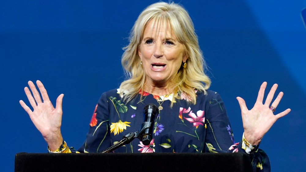 In this July 8, 2021 photo, first lady Jill Biden delivers remarks before the start of the finals of the 2021 Scripps National Spelling Bee at Disney World in Lake Buena Vista, Fla. Jill Biden will attend the opening ceremony of the summer Olympic games in Tokyo. The White House announced the trip Tuesday, even as the city has entered a new state of emergency over a rise in coronavirus cases.(AP Photo/John Raoux)