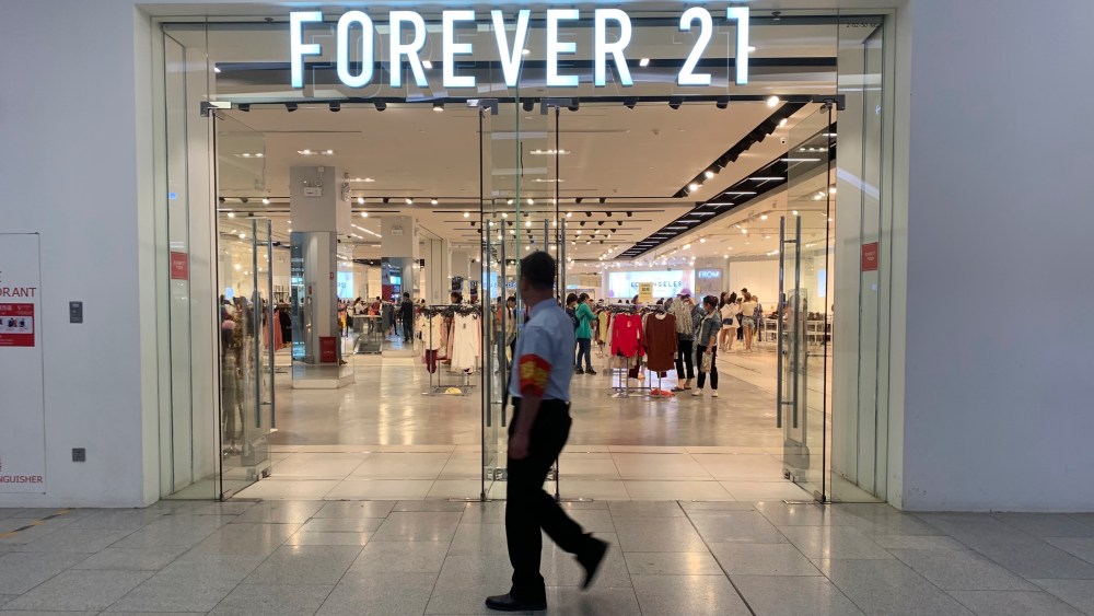 Customers shop at a store of Forever 21 to close down at a shopping mall in Beijing, China.