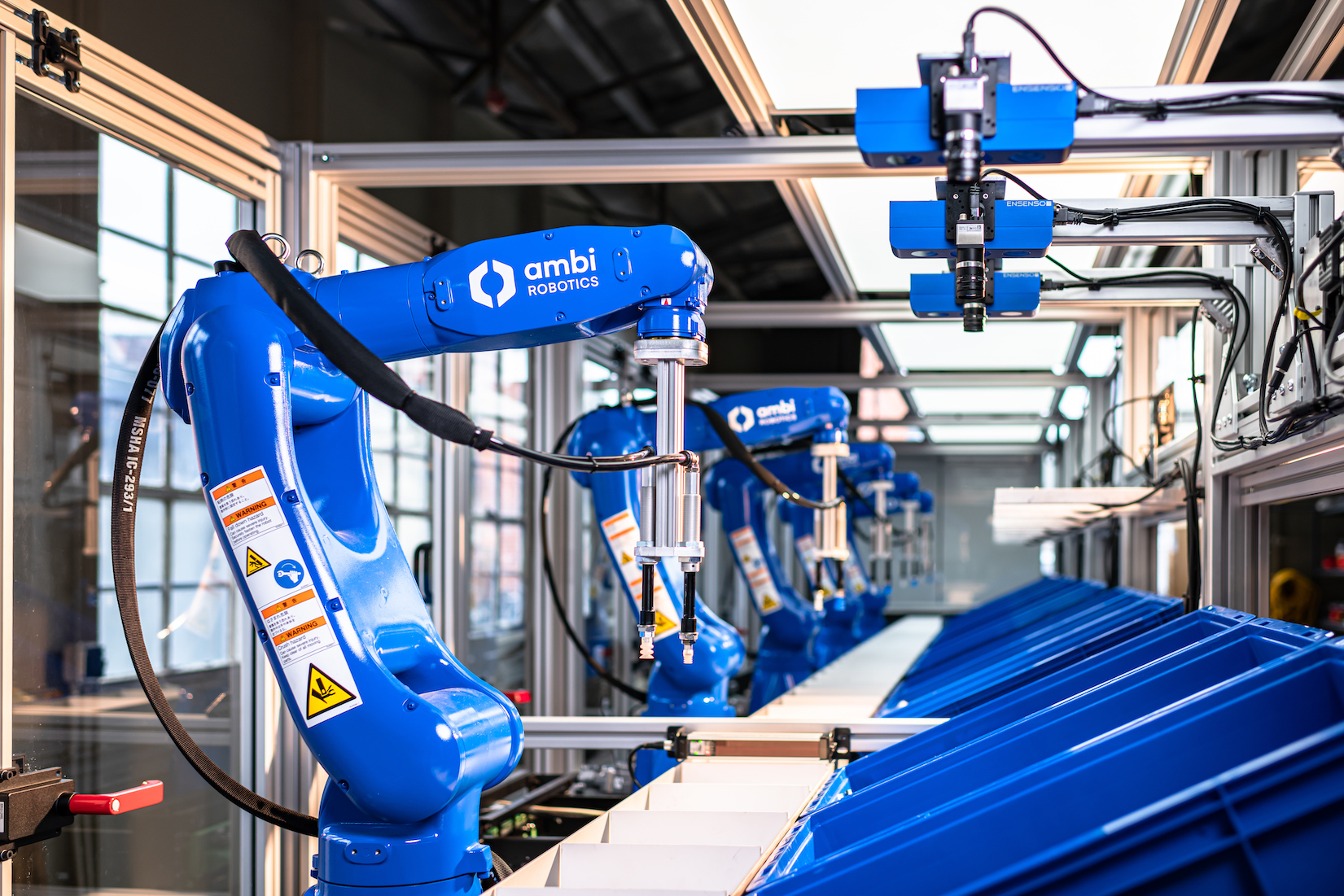 AmbiKit is designed to automate product bundling for faster delivery to increase order accuracy and reduce operating costs. The new kitting system includes a five-robot picking line, currently deployed to augment the pick and place tasks associated with one of today’s fastest growing e-commerce opportunities: online subscription boxes.