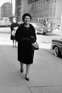 Estée Lauder strolls along 57th Street in New York City wearing a fur coat and matching hat on October 3, 1965.