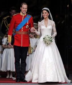 FILE - In this Friday, April, 29, 2011 file photo, Britain's Prince William and his wife Kate, Duchess of Cambridge stand outside Westminster Abbey after their Royal Wedding in London. With Prince Harry and Meghan Markle's May 19 wedding fast approaching, the fashion and bridal worlds are abuzz with talk of who the bride will pick to design her dress and what kind of look she would go for. (AP Photo/Martin Meissner, File)