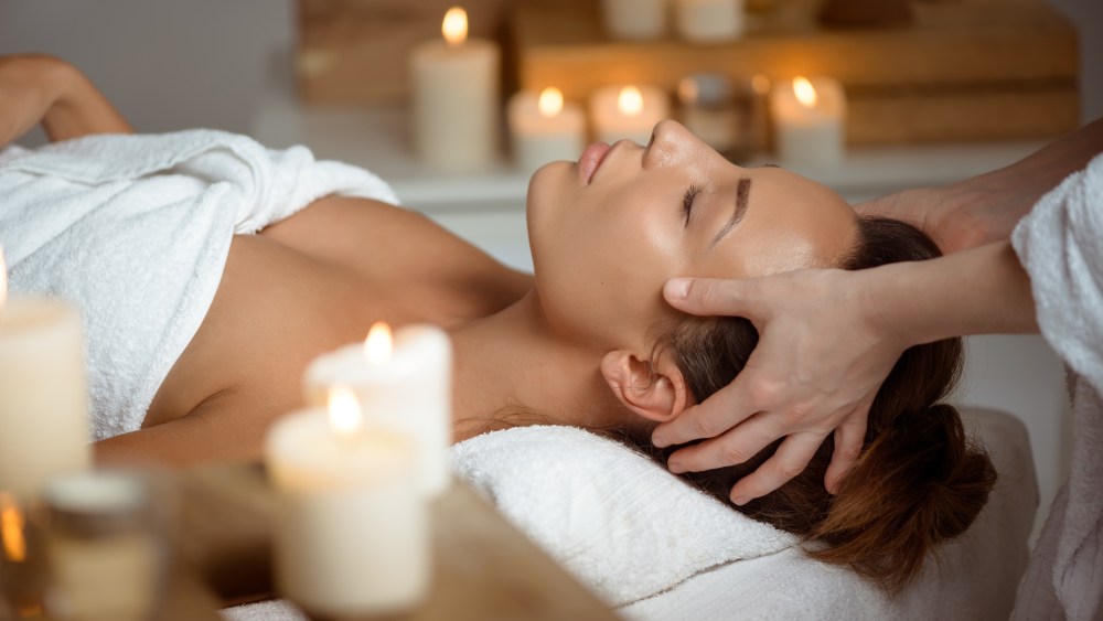 face massage relaxing in spa salon