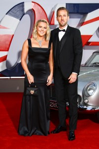 Kate Kane and Harry Kane pose for photographers upon arrival for the World premiere of the new film from the James Bond franchise 'No Time To Die', in London Tuesday, Sept. 28, 2021. (Photo by Joel C Ryan/Invision/AP)