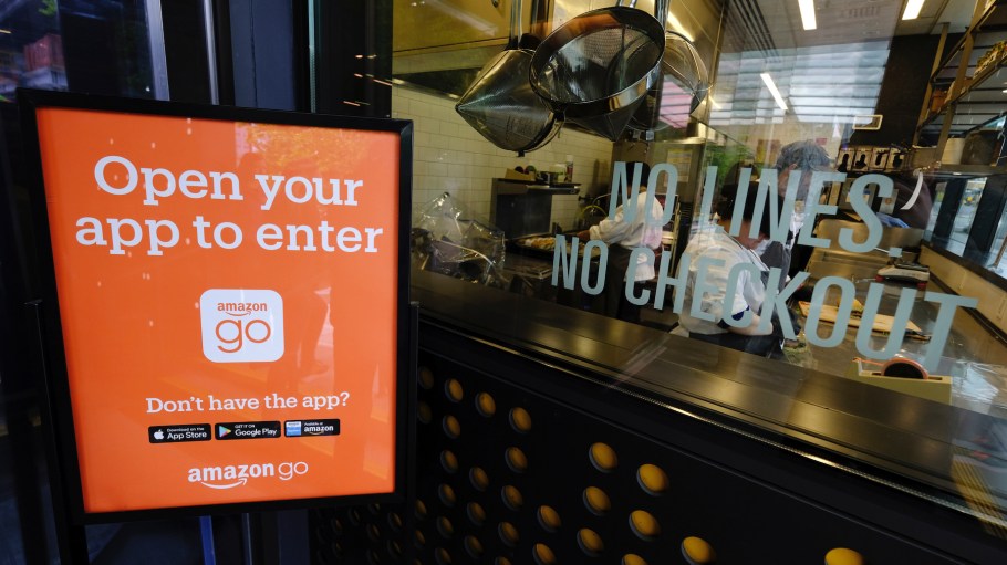 Employees make ready-to-eat food at the original Amazon Go convenience store in Seattle.