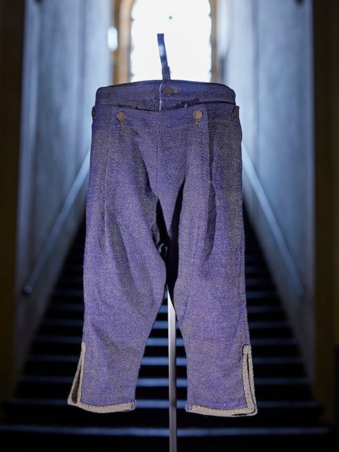 Diesel showcased a reproduction of the oldest documented jeans fabric, featuring denim trousers modeled after an historic nativity figurine.