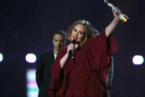 FILE - In this Feb. 24, 2016 file photo,  Adele holds the Best British Female Solo Artist award onstage at the Brit Awards 2016 at the 02 Arena in London.   Adele’s comeback album “25” has reached diamond status in less than a year. “25” was released last November and features the hits “Hello” and “Send My Love (To My New Lover).” Adele received a plaque for her top-selling achievement at Madison Square Garden in New York on Monday, Sept. 26 night after performing a whopping six shows at the venue. (Photo by Joel Ryan/Invision/AP)