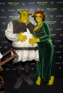 Model and television personality Heidi Klum, right, and boyfriend Tom Kaulitz dressed as Shrek and Princess Fiona arrive at her 19th annual Halloween party at Lavo New York on Wednesday, Oct. 31, 2018, in New York. (Photo by Evan Agostini/Invision/AP)