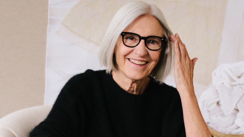 Eileen Fisher dressed in her signature black minimalism and frames.