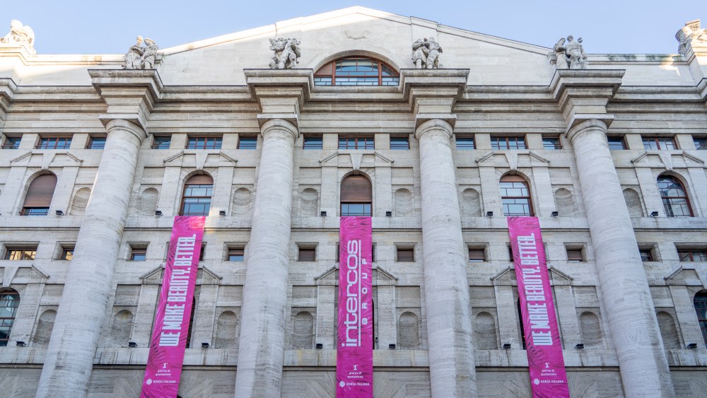 Intercos Group's banners covering the Palazzo Mezzanotte building, which houses the Italian Stock Exchange in Milan.