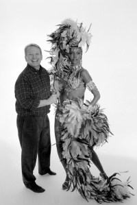 Bob Mackie with Model in Feathered Dress