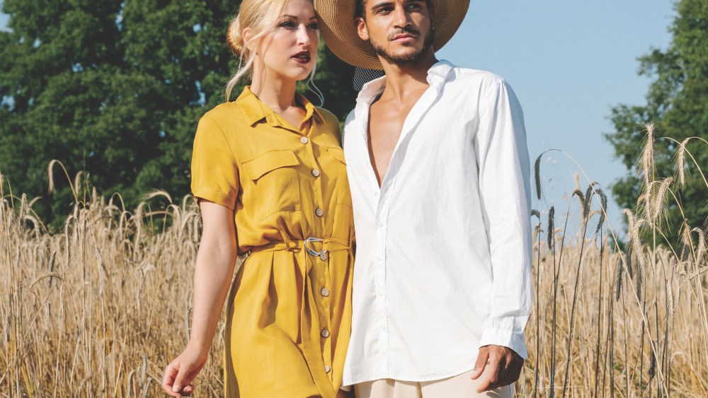 Llinars, Barcelona, Catalonia, Spain. A young and beautiful couple in the middle of the meadow.