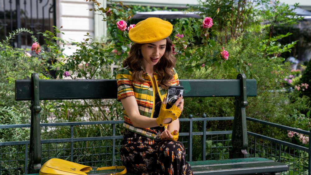 Emily in Paris. Lily Collins as Emily in episode 209 of Emily in Paris. Cr. Stéphanie Branchu/Netflix © 2021