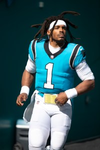 Carolina Panthers quarterback Cam Newton (1) runs onto the field before an NFL football game against the Miami Dolphins, Sunday, Nov. 28, 2021, in Miami Gardens, Fla. (AP Photo/Doug Murray)