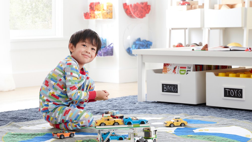 The toy brand known for its colorful bricks brings its playful style to a new Pottery Barn Kids line of bedding, sleepwear and more.
