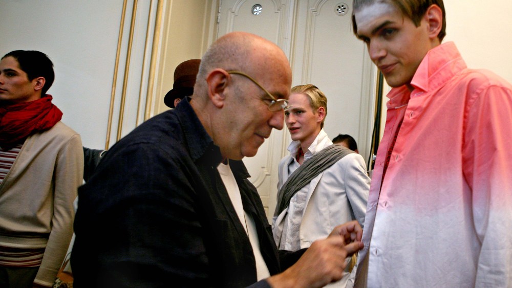 Spanish designer Antonio Miro puts a last touch to a model before presentation of men's Fashion Spring-Summer 2009 collection, in Paris, Sunday, June 29, 2008.(AP Photo/Jacques Brinon)