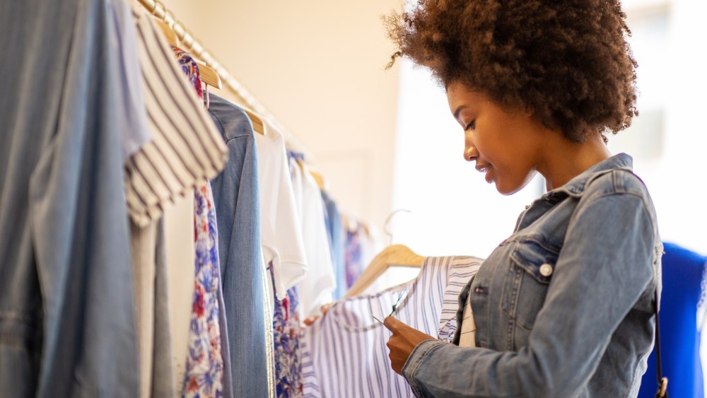 woman shopping for clothes in store